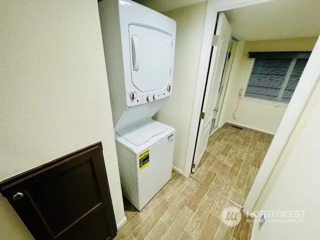 Generous size Washer-Dryer unit in the hallway just off the bedroom and bath makes laundry day so simple and convenient.