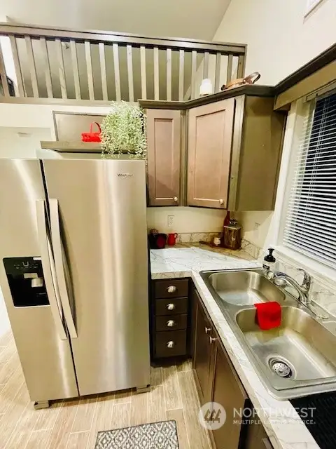 Newer, modern, full size appliances and lots of storage make this kitchen a wonderful space to make meals for one or entertain.