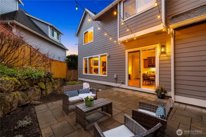 The rear of the house has a large paved patio.