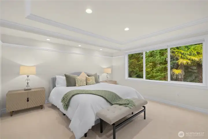 The primary bedroom has fresh paint, lighting and carpet. Lots of natural light and privacy.