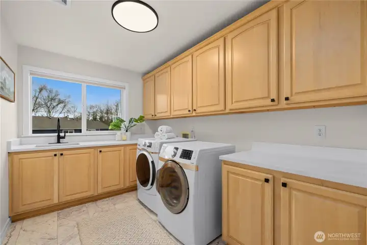 Laundry area upstairs has been updated. New paint, lighting and counters.