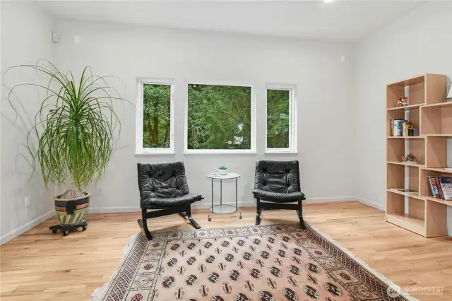 A well-appointed office with direct access to the outdoor deck.