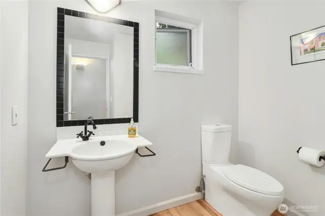 Main floor powder room for added convenience.