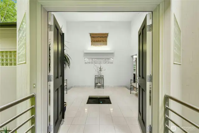 Grand entryway with a water fountain welcomes you home.