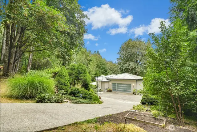 The street view showcases the home’s oversized two-car garage.