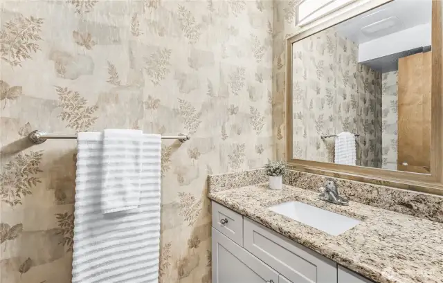 Main floor powder room for guests to freshen up!