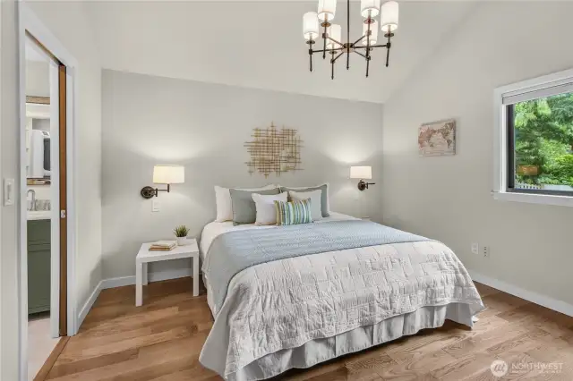 Architecturally designed main floor primary suite with vaulted ceilings!