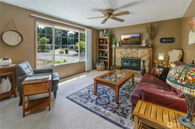 Large Great Room with wood burning stove with fan