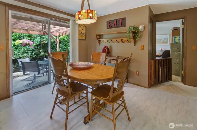Kitchen Nook/Dining looking outside to patio and down hall to bedroom wing of the home.