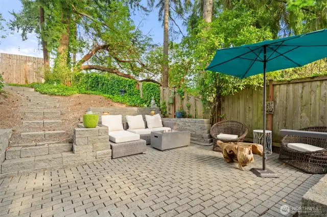 First tier paver patio with built in lighting. Gas fire pit stays with the home.