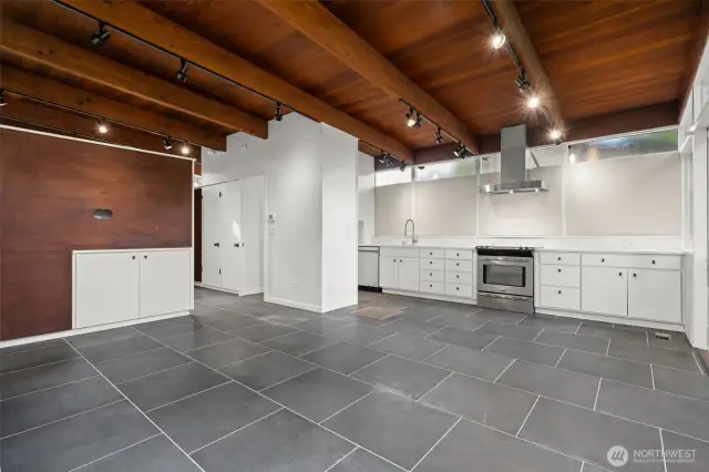 Classic MCM. Seamless spatial integration of living, dining, and kitchen areas.TV wall ready with hidden cabinet for cords.