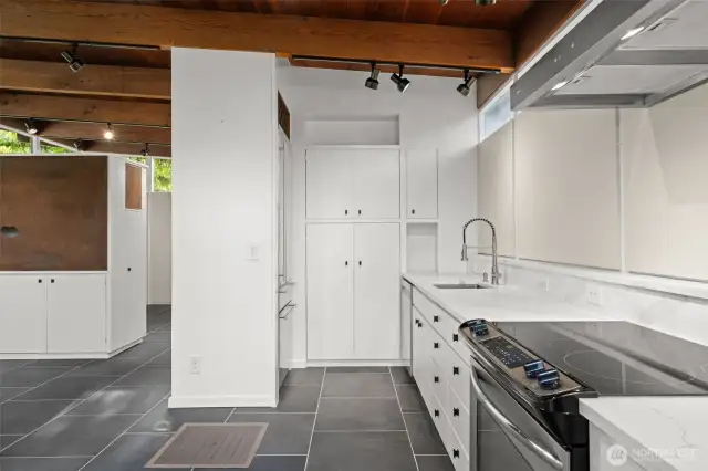 Sleek, functional kitchen with ample counter surfaces and smart cabinet storage.