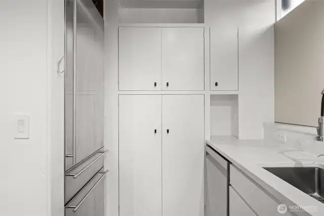 Sleek, functional kitchen with ample counter surfaces and smart cabinet storage.