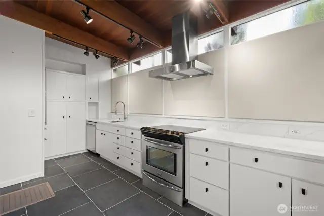 Sleek, functional kitchen with ample counter surfaces and smart cabinet storage.