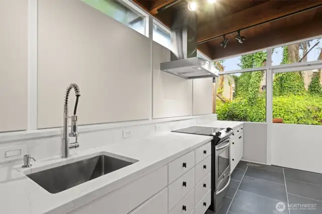 Sleek, functional kitchen with ample counter surfaces and smart cabinet storage.