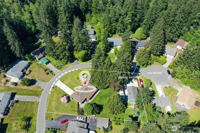 Aerial Photo of house, large lot with fenced back yard, 1000 sq ft shop with private entrance just off of the cul-de-sac.