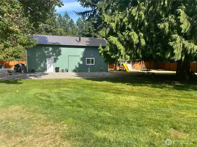 Nice 1000 sq ft shop, with childrens play set, notice the back yard is fully fenced.