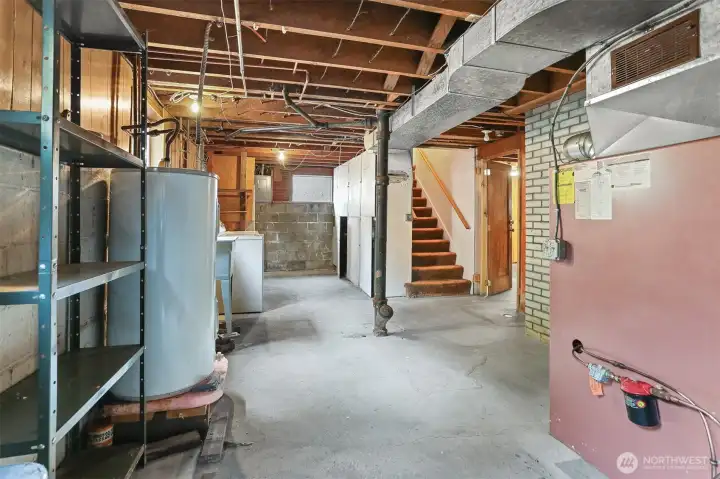 View of basement entry and washer and dryer area.