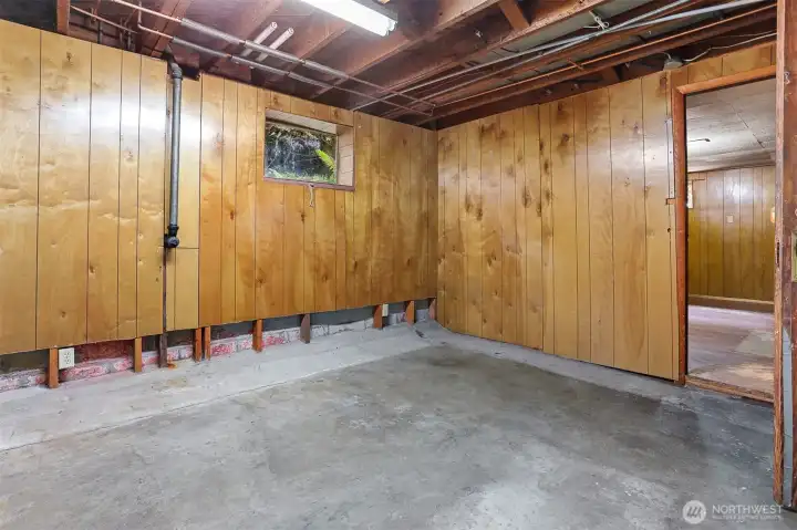 Room that leads to outside basement entry.