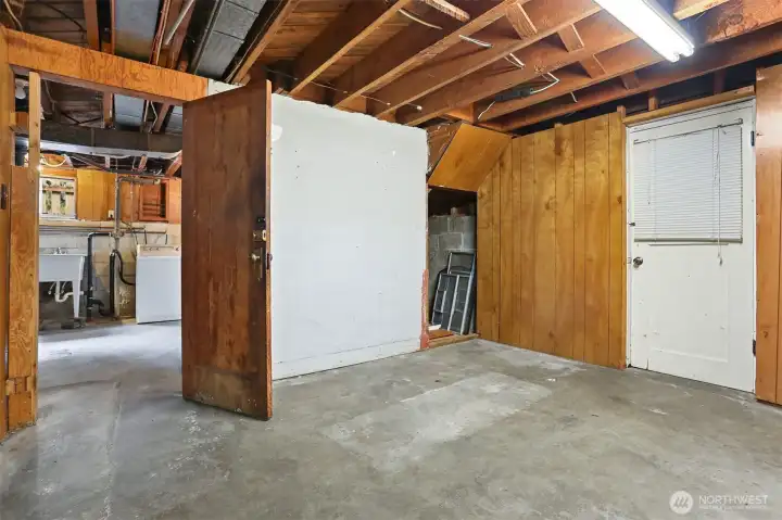 Room that leads to outside basement entry.