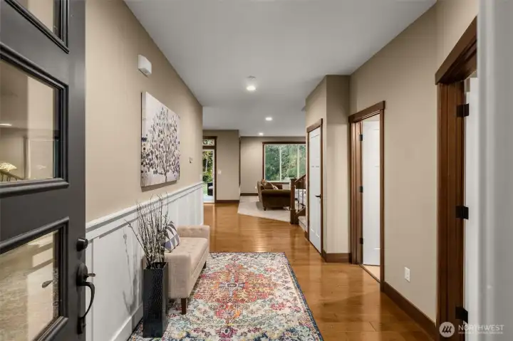 An extra wide foyer provides room for warm hellos and long goodbyes. The 3 doors on right side of photo: 1st door is the office, middle door is the bathroom, closed door is a large L-shaped closet.