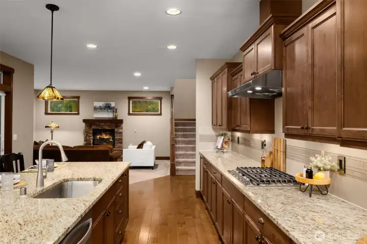 The kitchen is the central space, connecting to the living room and the stairway to the 2nd floor.