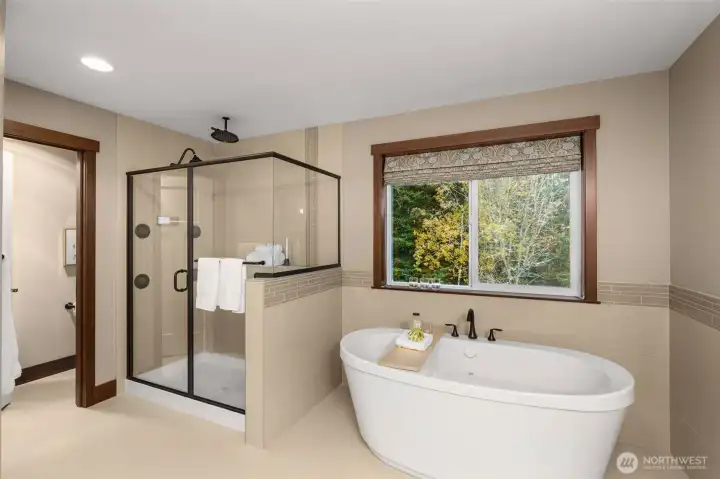 The soaking tub, separate shower and private water closet make this primary bath feel like your own luxury spa.
