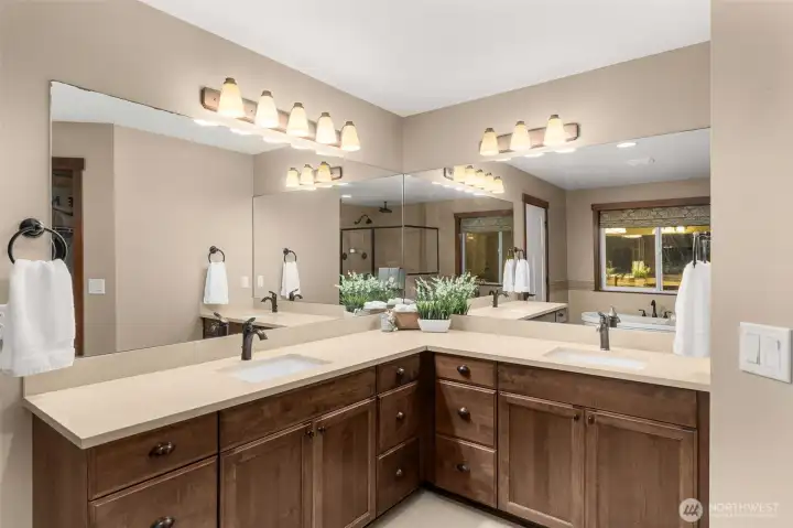 Double sinks and abundant counterspace and mirrors make getting ready a breeze. Extra drawers for easy access to everything.