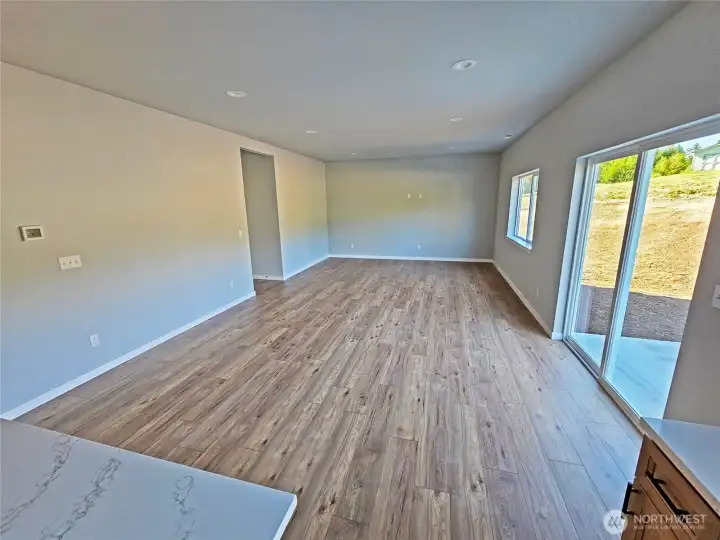 Great Room off of the kitchen. Great wall space to accomodate a huge flat screen to watch your favorite sports events. Slider access to the concrete BBQ  patio