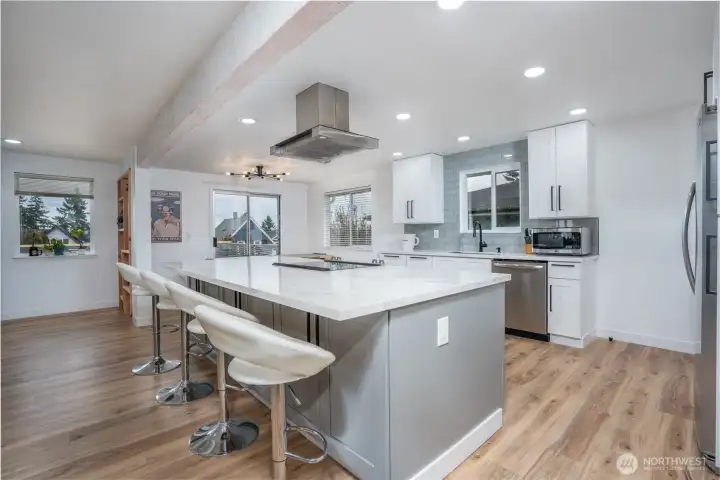 Cabinets on both sides of kitchen island.