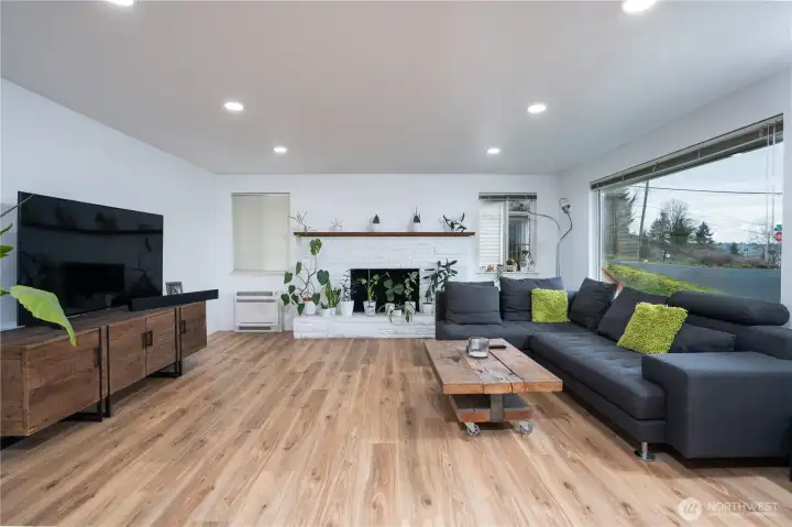 Large open living room bursting with natural light.