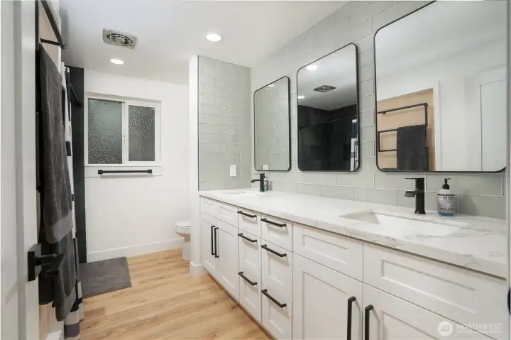 Upstairs full bath, with quartz counter tops and stone wall shower.