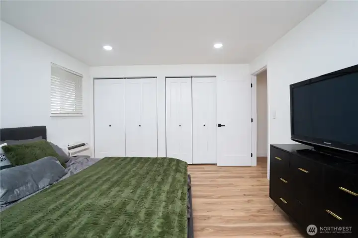 Primary bedroom with double closets.