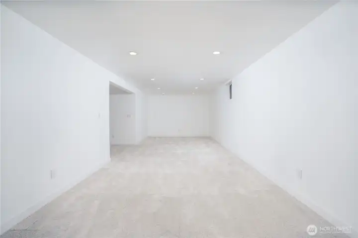 The left side of the bonus room is wired and plumbed for a kitchen addition.