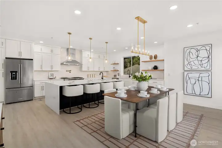 upgraded cabinetry, sleek countertops,premium appliances & an oversized marble waterfall island designed for elevated entertaining & daily living.
