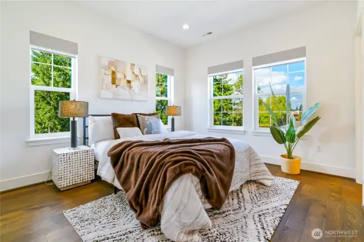 Primary bedroom w/ wood floors