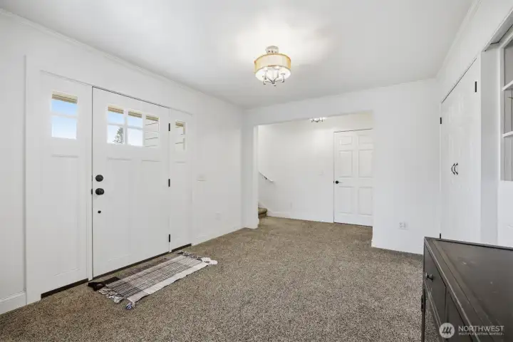 Once inside you will notice that the rooms are all large and the floorplan well thought out. The entry was once a bedroom and does have the wood floor under most of the carpet that matches that of the living room).