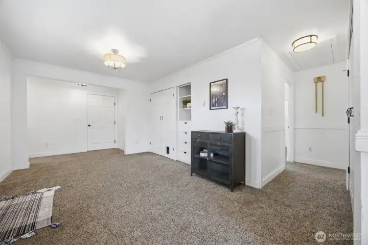 There is abundant storage throughout the home, and the 2 vehicle, attached garage (door to the left) is large enough for two vehicles and a workbench/shop area.