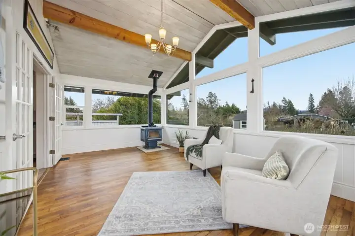 This room was originally a very spacious open back sitting porch for the original home. There is a wonderful free-standing wood stove that heats this room on cold winter days!