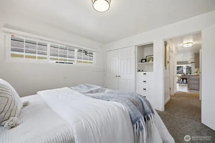 Another view of the main floor bedroom with the large closet and built-in drawers and cabinet.