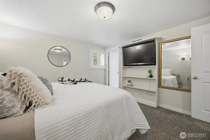 Looking across the primary suite toward the large primary bath.