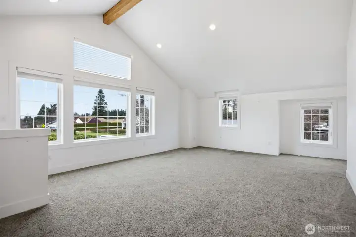 Looking across this spacious room that has west facing windows. There are mini-split heating systems here so there is heat and air conditioning as well.