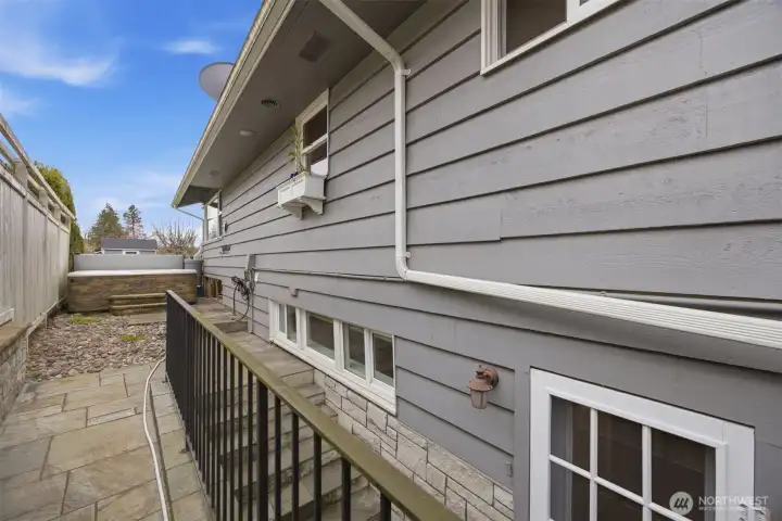 The stairway leads to the basement and there is private access from the lower level to the hot tub, making it ideal for the primary suite, as well as the laundry room!