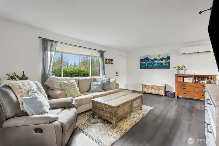 Living room for Unit 8313 offering the Ductless Mini Split for efficient heating & cooling, plus LVP flooring.