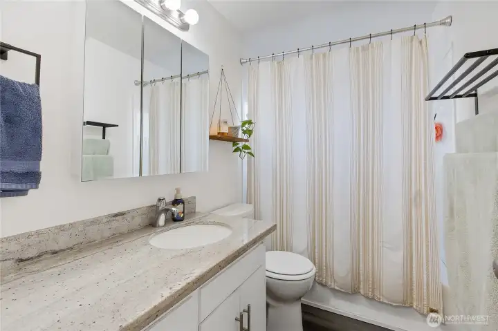 Bathroom for Unit 8313 with granite counter.