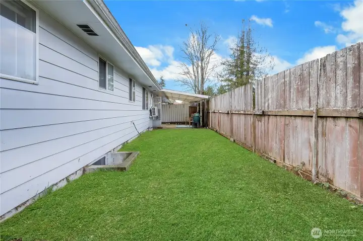 Side yard and covered patio off of unit 8313.