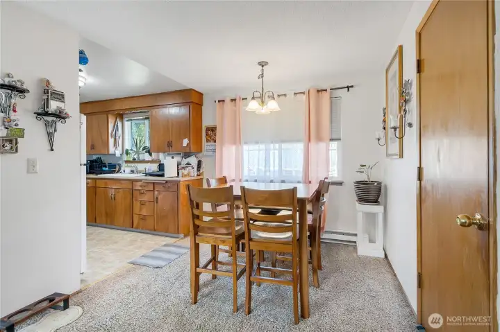 Dining space in unit 8311. Door to garage is on the right.
