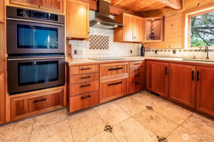 Custom kitchen built by Treehouse Remodeling. Drawers are extra-long inside for additional storage. A central vacuum system connected to just sweep floors to vacuum without using vacuum hoses.