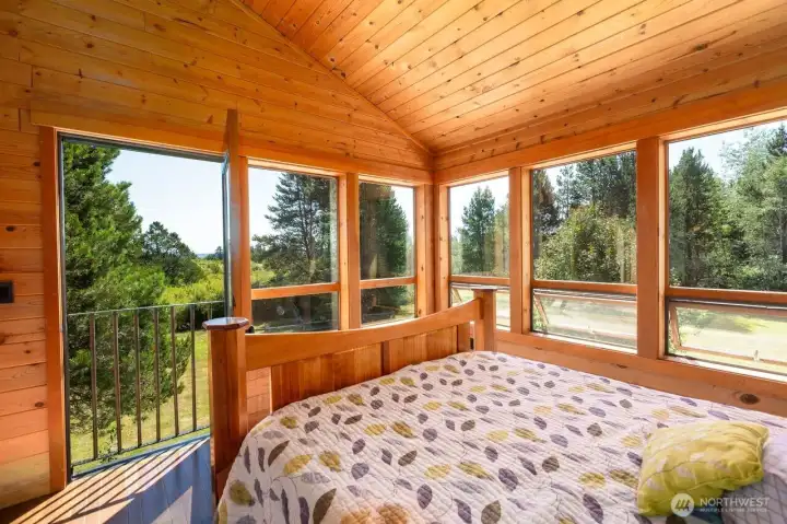 Primary bedroom faces south and overlooks fields.