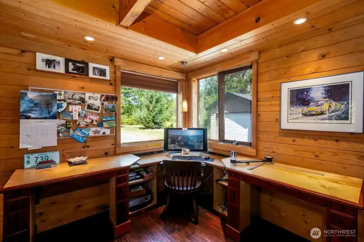 Guest bedroom serves as owners' office. Custom built desk on slides allow room for two to work side by side. A 3/4 bath off guest bedroom located on main level of house.